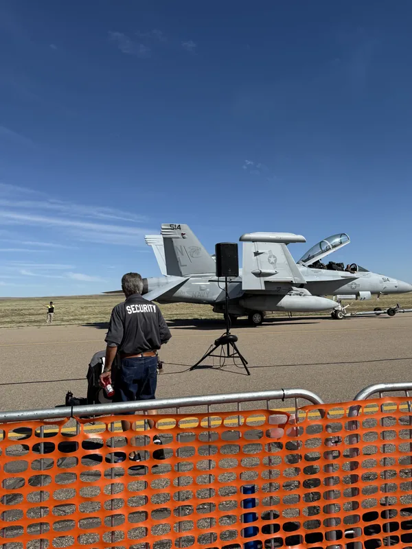 MarTech security guard at the Pueblo Airshow with an F/A-18 Hornet