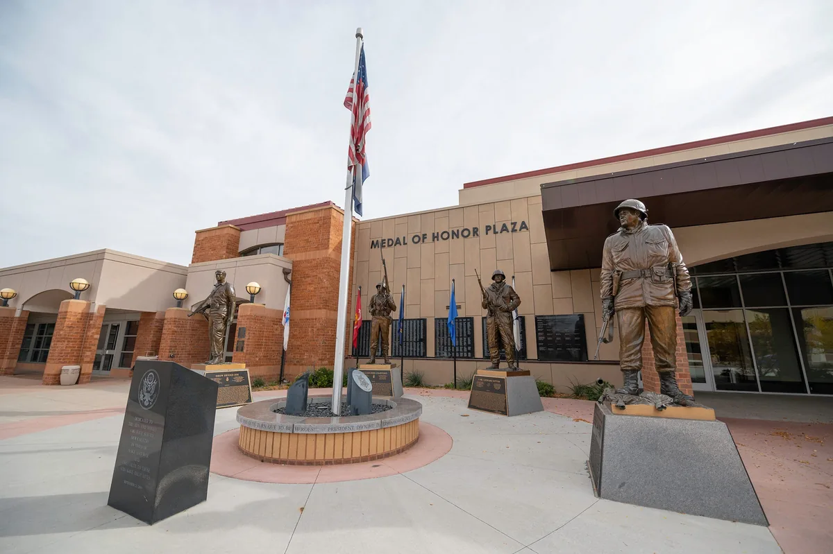 Pueblo's Medal of Honor Plaza — bronze statues of Pueblo's four Medal of Honor recipients with the American flag