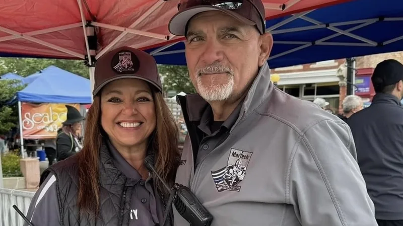 Paul and Renee Martinez in MarTech uniforms working an event